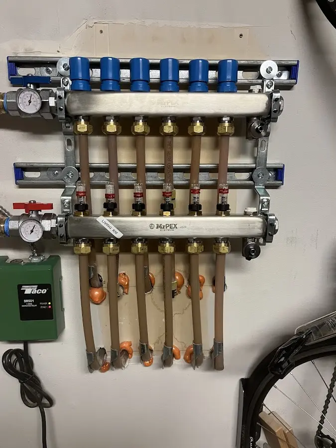 Plumber performing Water Heater Repair at a residential property in Landen